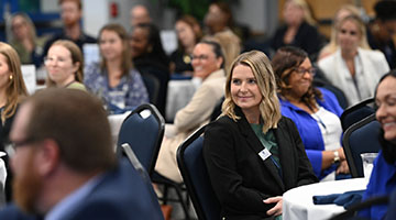 Employer Summit participants sitting down to watch a panel