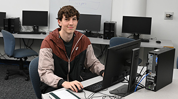 Jake Sutton working on a computer