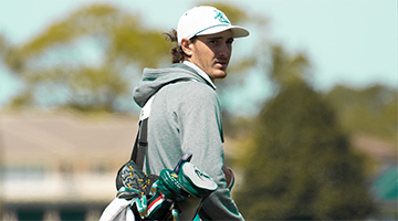 Nick Gabrelcik carrying his golfing bag