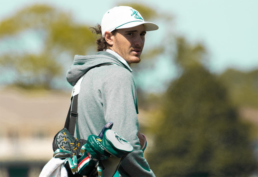 Nick Gabrelcik carrying his golfing bag