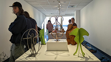 Students installing mini sculpture park at the Jacksonville International Airport