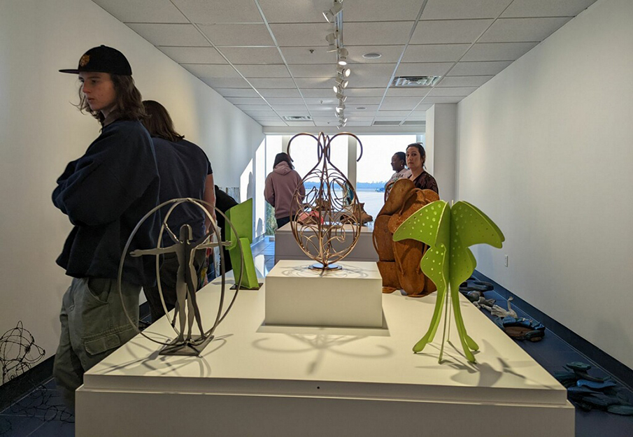 Students installing mini sculpture park at the Jacksonville International Airport