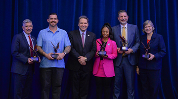 Sam Inman, David Main, President Moez Limayem, Rhianna Scyster, Sam Garrison and Suzette Wilhelm