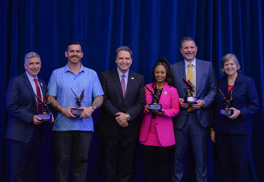 Sam Inman, David Main, President Moez Limayem, Rhianna Scyster, Sam Garrison and Suzette Wilhelm