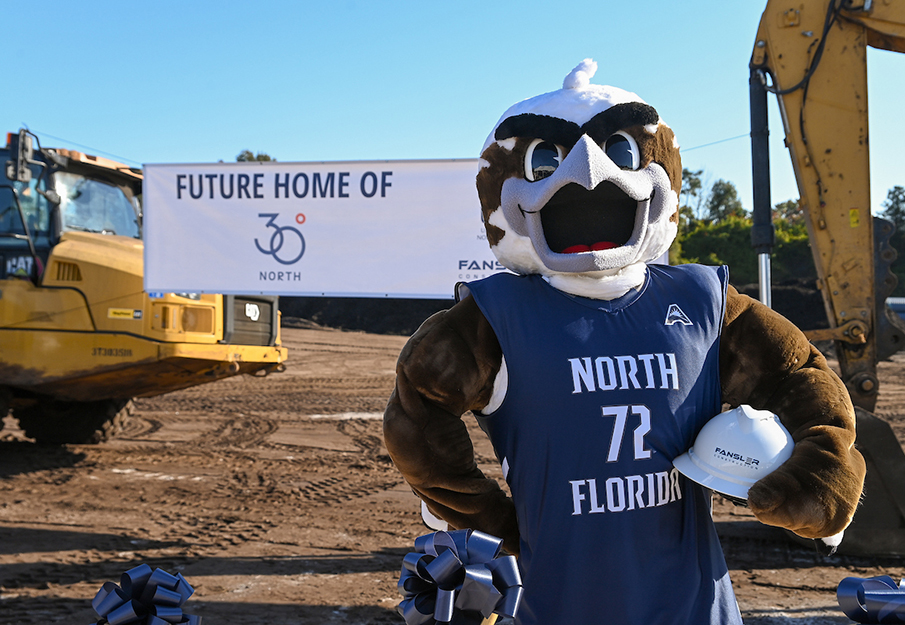 Ozzie holding hard hat standing at 30 Degree North groundbreaking