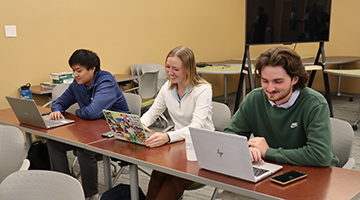 Sports Management students Malakai Nordquist, Megan Witucki and Fintech student James Kim