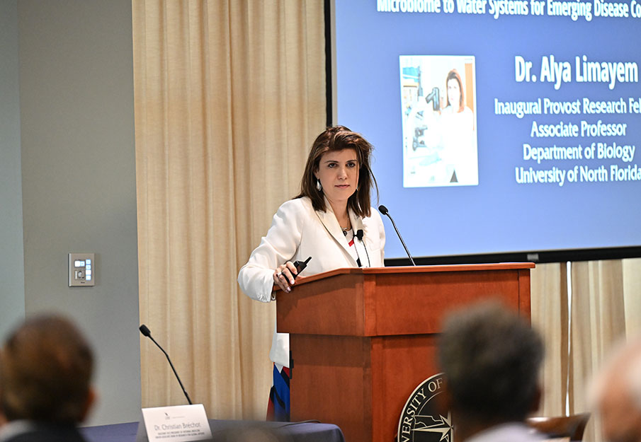 Dr. Alya Limayem at podium