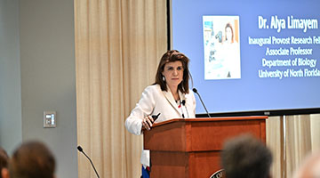 Dr. Alya Limayem at podium