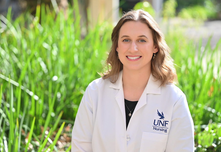 Randi Corley headshot in white lab coat