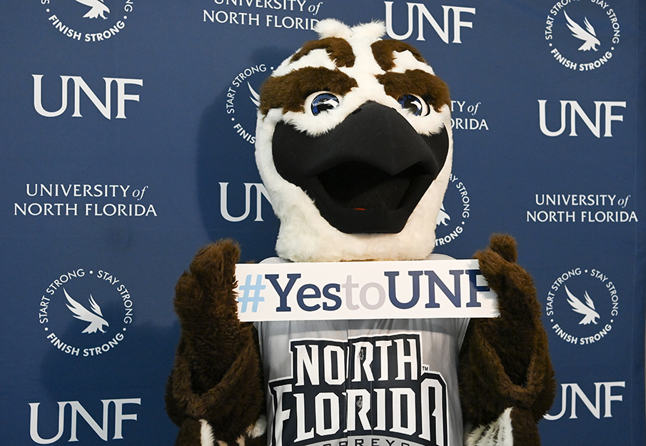 Ozzie holding a 'Yes to UNF' sign