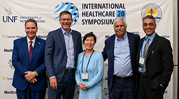 UNF President Moez Limayem, Mei Zhao, Shyam Paryani and Ruple Galanni