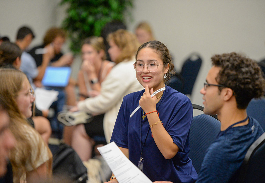 UNF MedNexus students talking at a round table