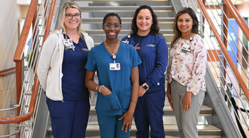 MedNexus and HCA staff standing together, including Zharia Ireland (second to left)