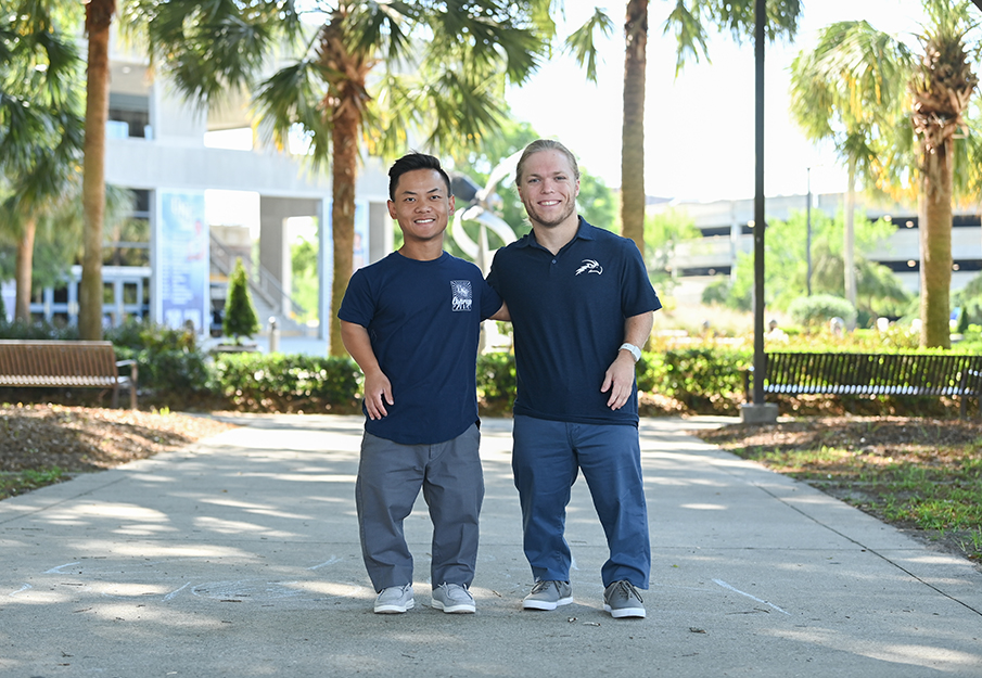 Morgan Ray and Michael Ray standing in front of arena building