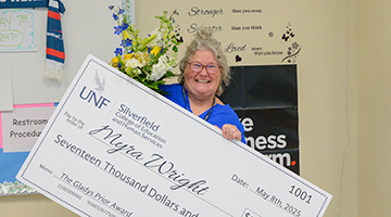 Myra Wright holding her check