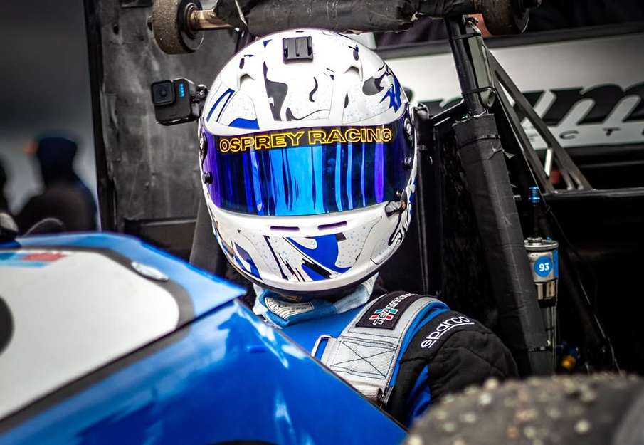 Student racer sitting in car