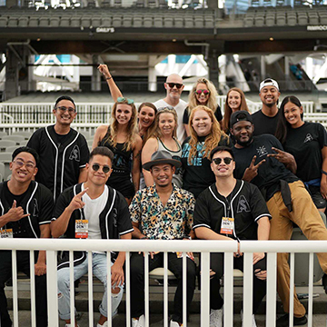 Andrew Sapin sitting in EverBank stadium with other performers