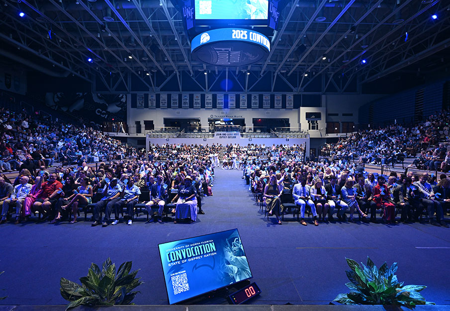 Faculty, staff and students sitting in the crowd of Convocation 