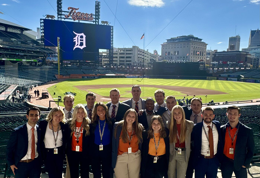 Detroit Tigers sales team standing in front of the baseball field