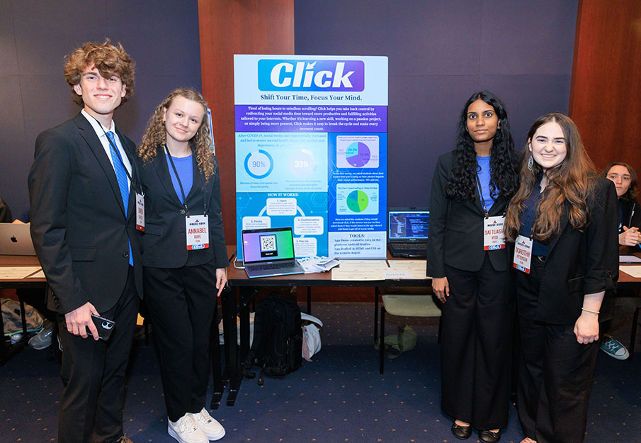 Sai Tejasvi Vegi, Annabel Kaye, Owen Bayley and Dorothy Peterson standing in front of their presentation poster