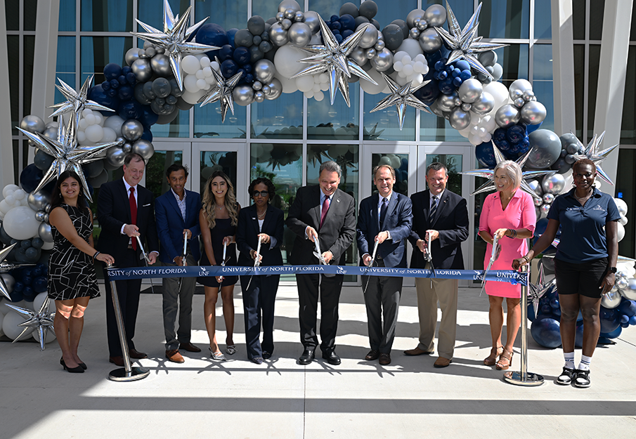 Ribbon cutting in front of new Honors residence hall