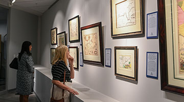 Participants observing maps in the Allen Lastinger Center