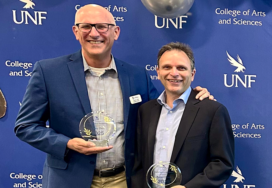 Jimmy Orth (left) and Robert Peek (right) holding their awards