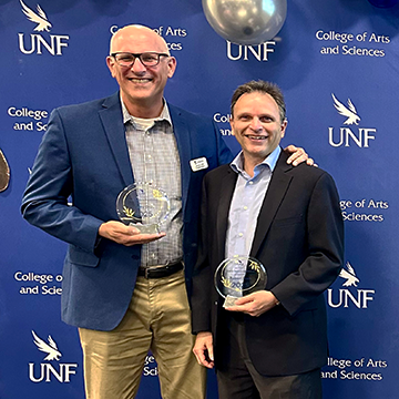 Jimmy Orth (left) and Robert Peek (right) holding their awards