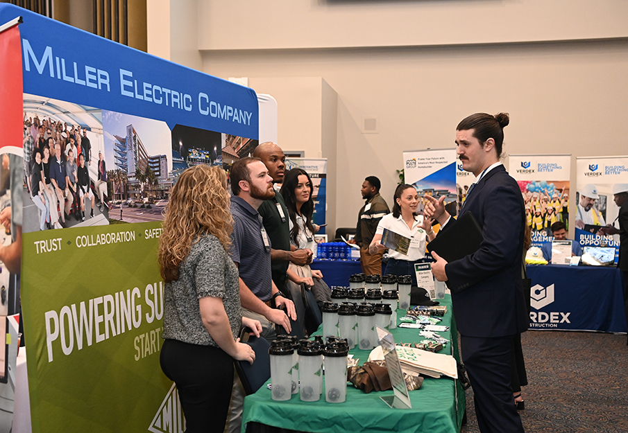 Student speaking with Miller Electric at a career event