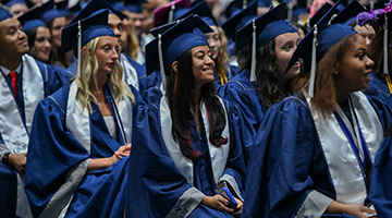 Graduating students sitting together