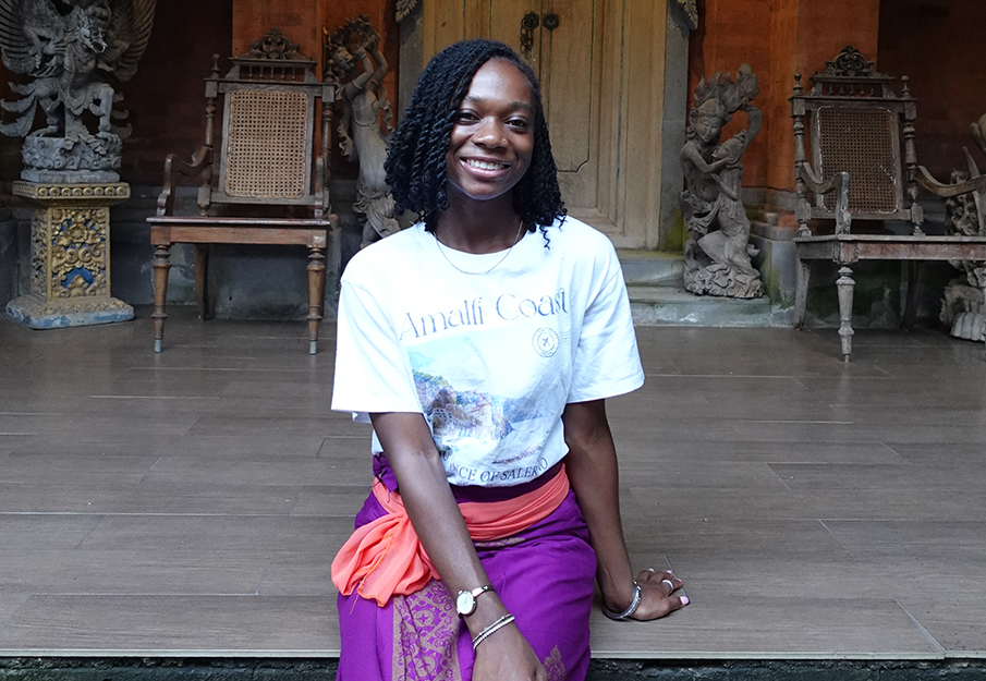 Alaina Anglin sitting on platform in Bali