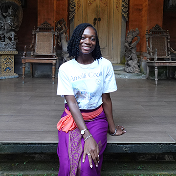 Alaina Anglin sitting on platform in Bali