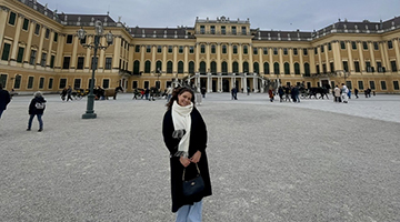 Brenna Brisson standing in front of Bonn University in Germany