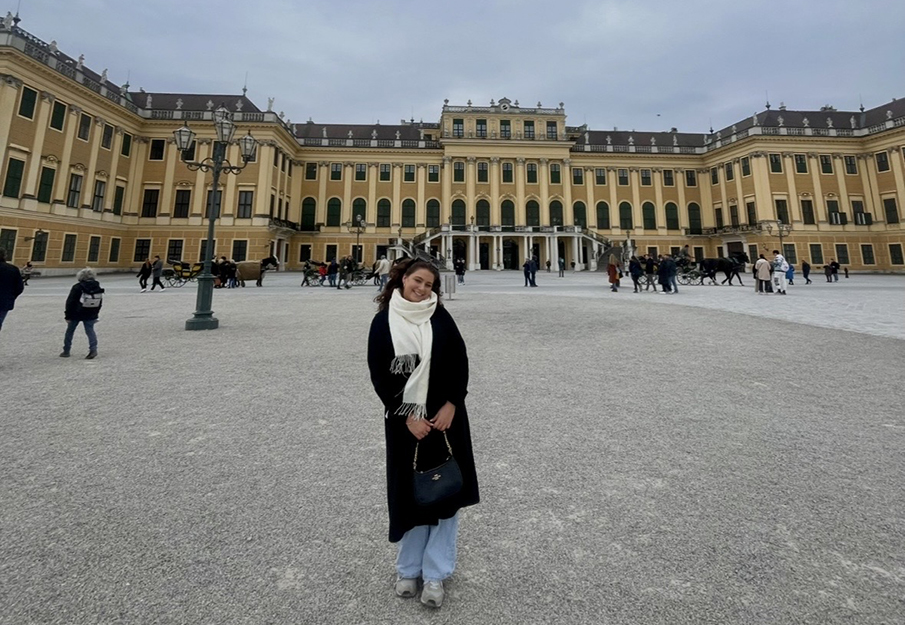 Brenna Brisson standing in front of Bonn University in Germany