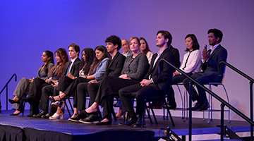 Panel of students presenting at the DSSG event