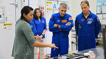 Luke Delaney and the rest of NASA’s SpaceX Crew-13 being shown technology