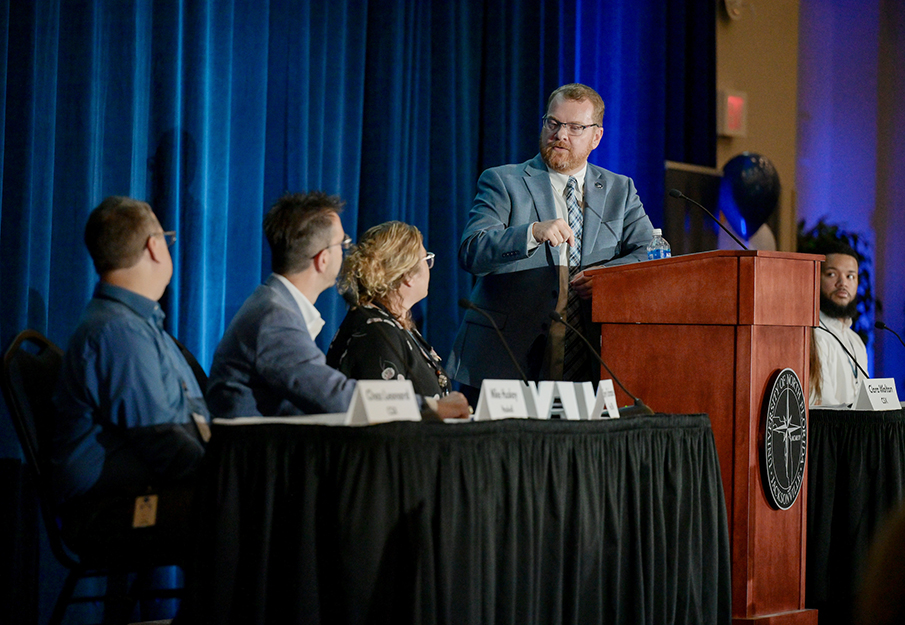 Scott Curry, senior director of industry engagement for UNF Career Services, speaking on stage at the UNF Employer Summit