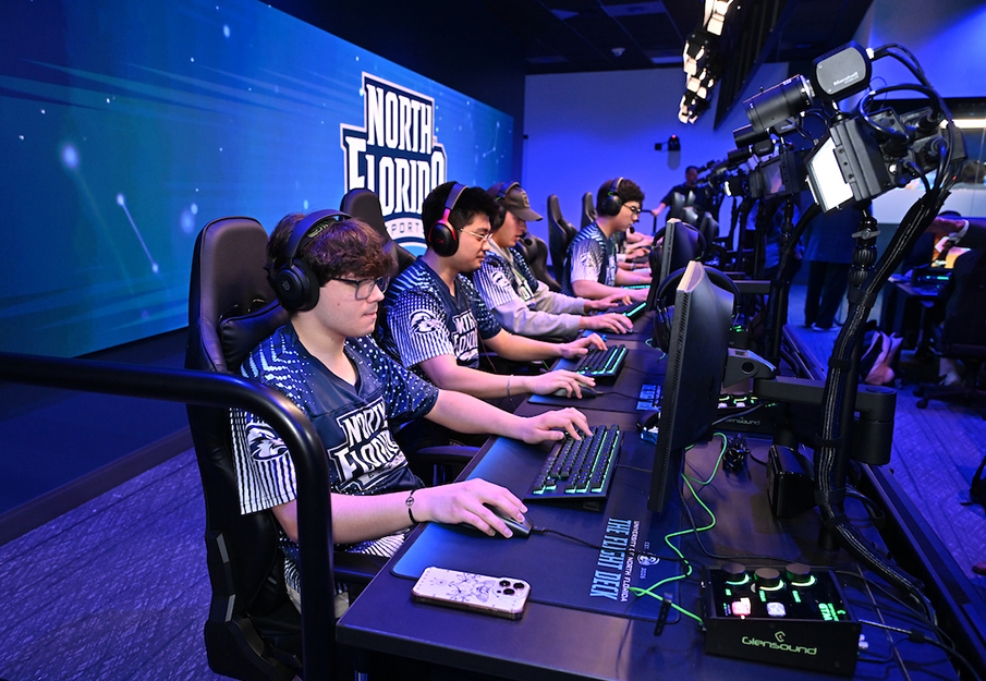 Students playing on gaming system in UNF Esports arena
