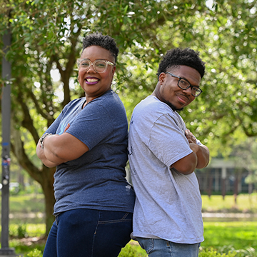 Janelle and Julian Hooks posing back-to-back