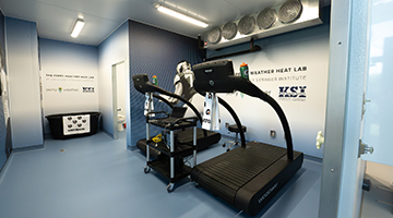 Two treadmills and an ice bath inside the Korey Stringer Institute Heat Lab at UNF