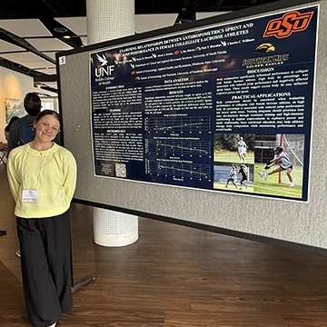 Riley Parrish standing next to poster she is presenting