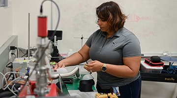 Sayyada Harry working on a machine