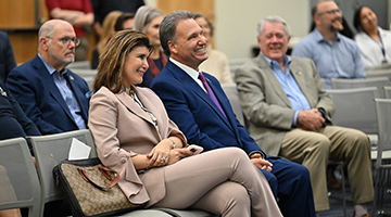 UNF President Moez Limayem sitting in front row at farewell reception