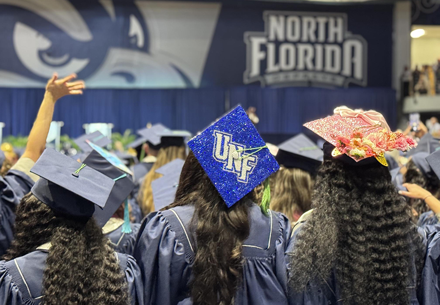 Decorated 'UNF' cap at spring 2026 commencement