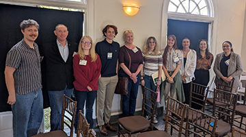 Group of UNF students and faculty who presented at the symposium standing together