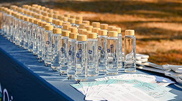 A bunch of water bottles on a table