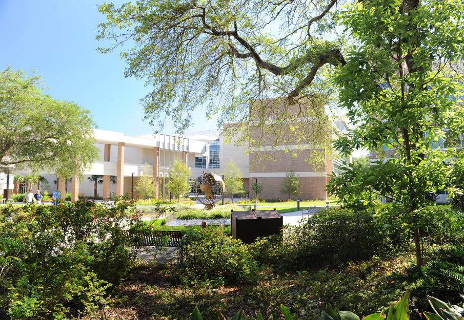 UNF Biological Sciences building and courtyard with a globe statue