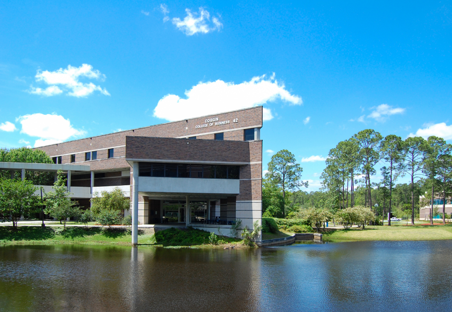 Coggin College of Business with the lake on a bright sunny day