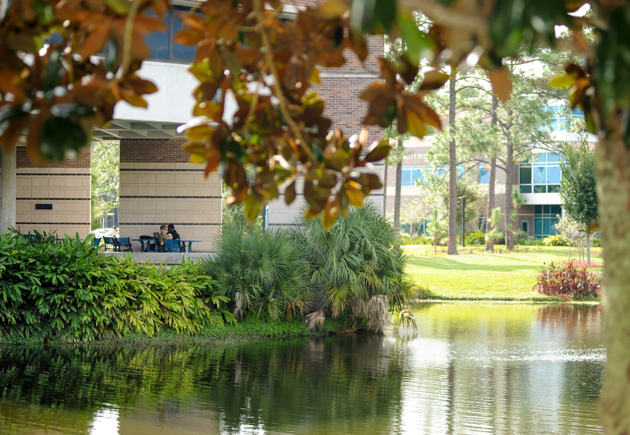 Coggin College of business with the lake and trees