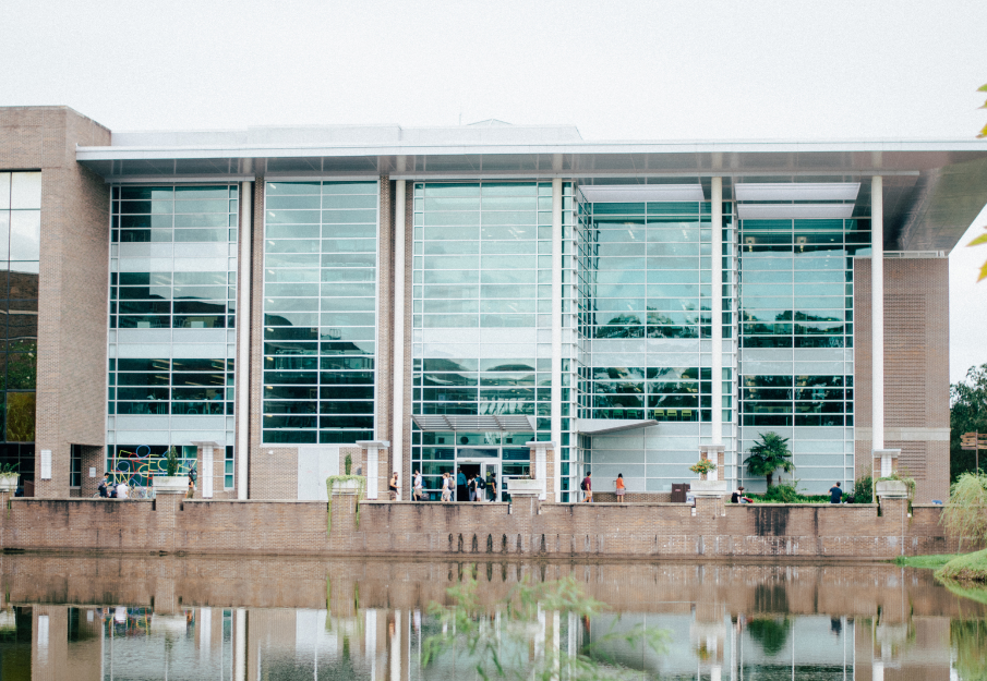 UNF Library exterior shot on a cloudy day with a boardwalk